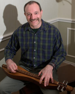 Mark Gilston plays a mountain dulcimer